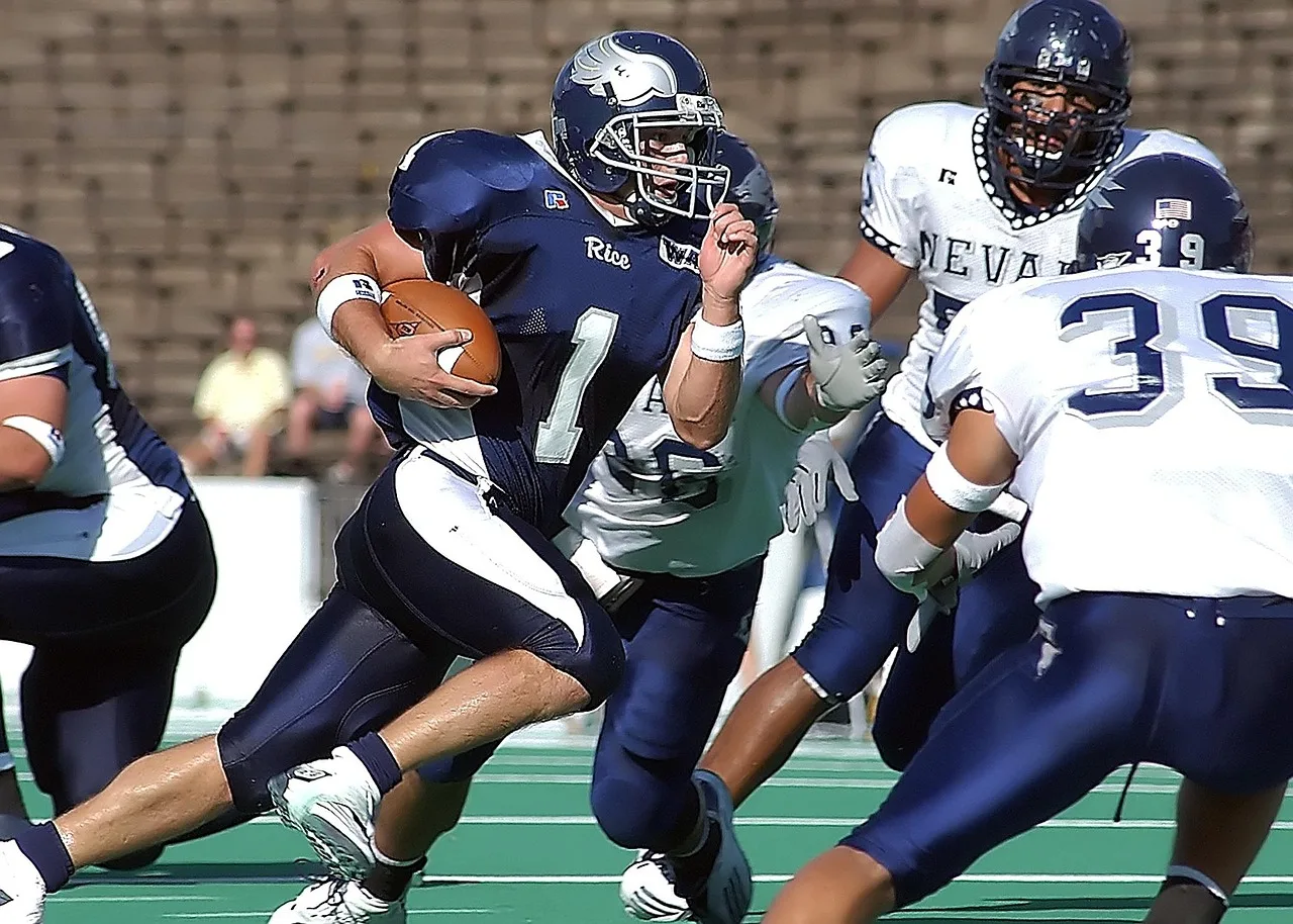 football, quarterback, running back, action, american, game, sport, athlete, ball, american football, player, competition, athletic, team, helmet, football field, college, football player, running, ball carrier, stadium, play, texas, male, leadership, football, american football, american football, american football, american football, american football, football player. College Athlete NIL Earnings: Reported Ranges, Revenue Sharing and Taxes
