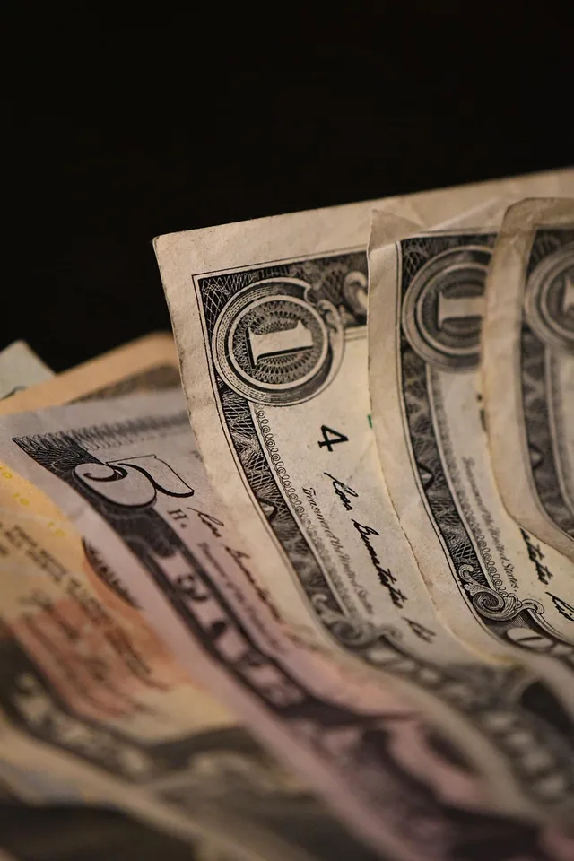 money, cash, dollar, currency, bill, banknote, paper money, finance, wealth, savings, income, closeup. How to read career earnings totals honestly