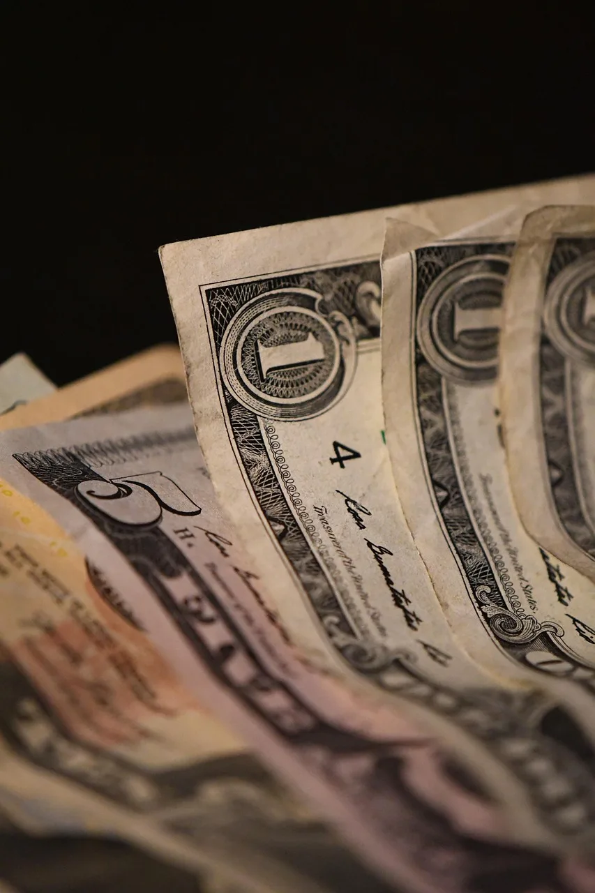money, cash, dollar, currency, bill, banknote, paper money, finance, wealth, savings, income, closeup. How to read career earnings totals honestly