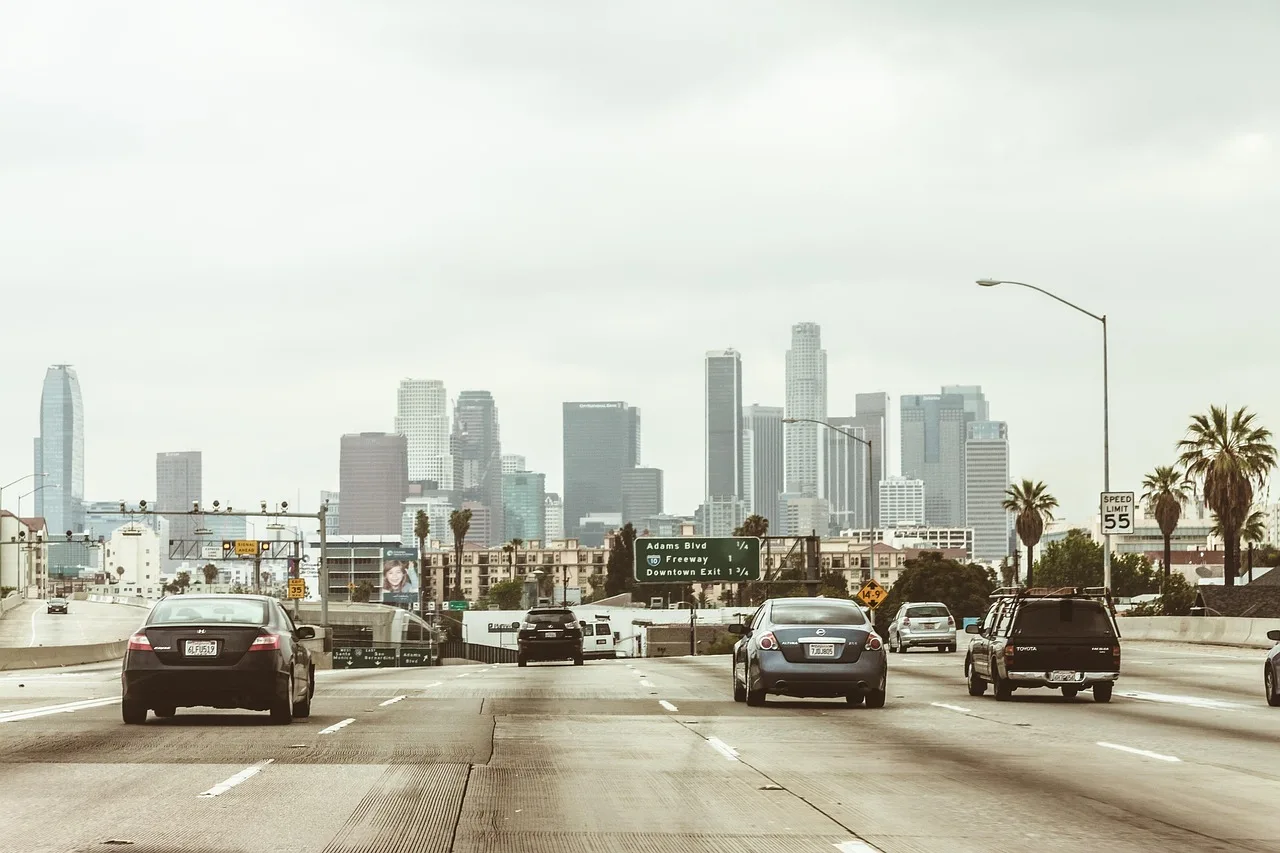 highway, cars, traffic, vehicles, towers, nature, buildings, skyscrapers, los angeles, downtown, center, freeway, office center, city, megalopolis, business centre, architecture, office, high-rise, multistory building, motion, road, asphalt, street, transport, sky, panorama. How living costs in Los Angeles and New York City reduce celebrity net worth
