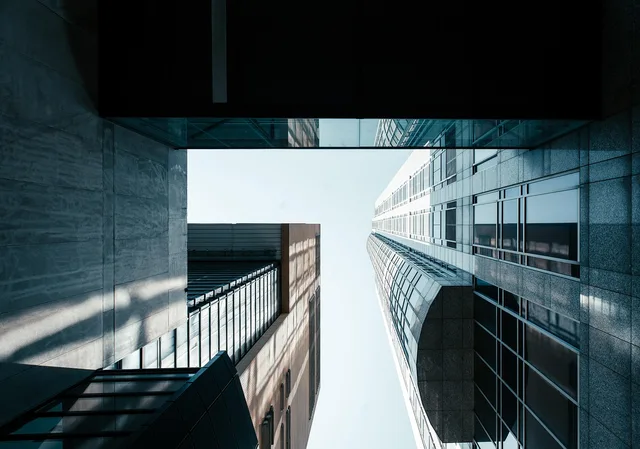building, skyscraper, facade, modern, office building, urban, architecture, city, windows, perspective, structure, horizon, glass, reflection, business, corporate. Contracts and Salaries: The Parts Behind a Deal Total